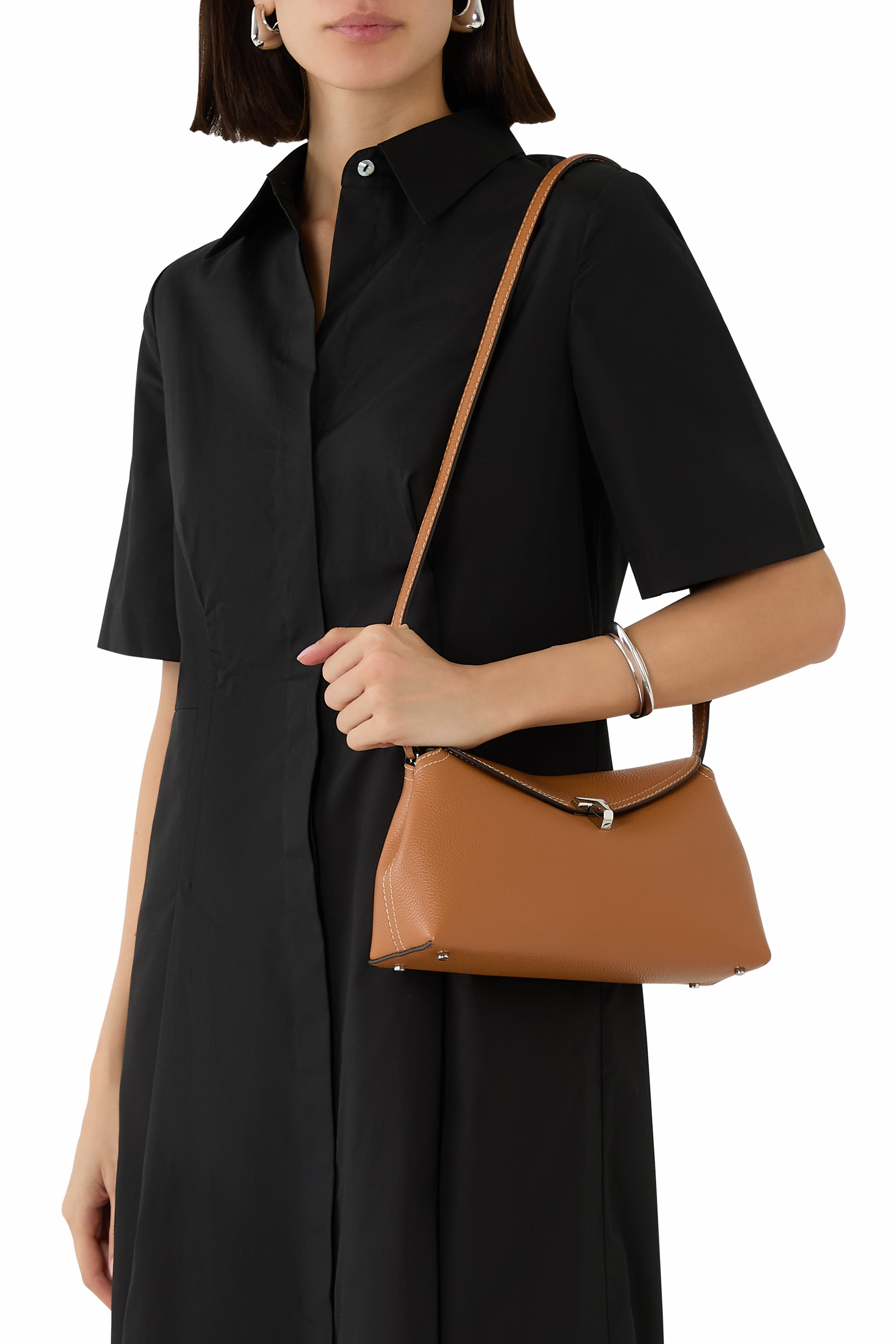 كلاتش بإغلاق على شكل حرف T