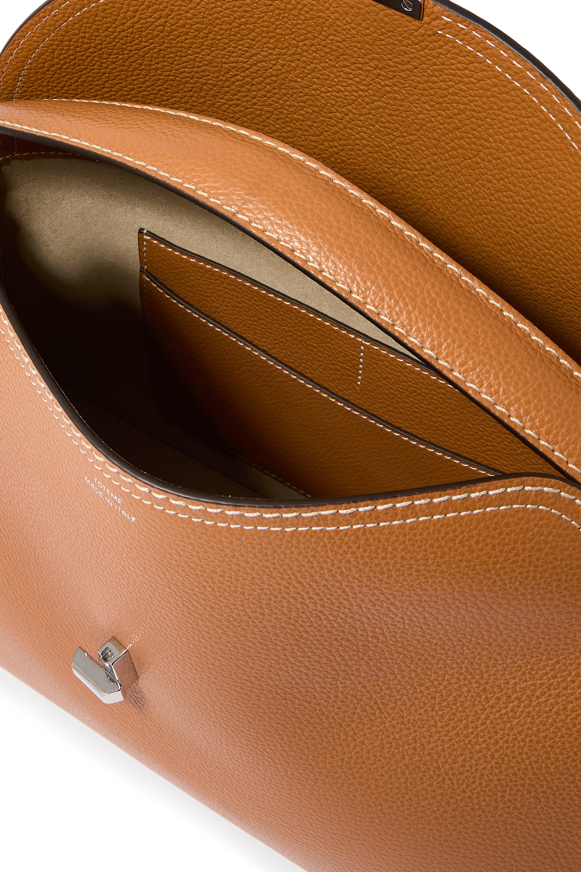 حقيبة يد بإغلاق على شكل حرف T ويد علوية