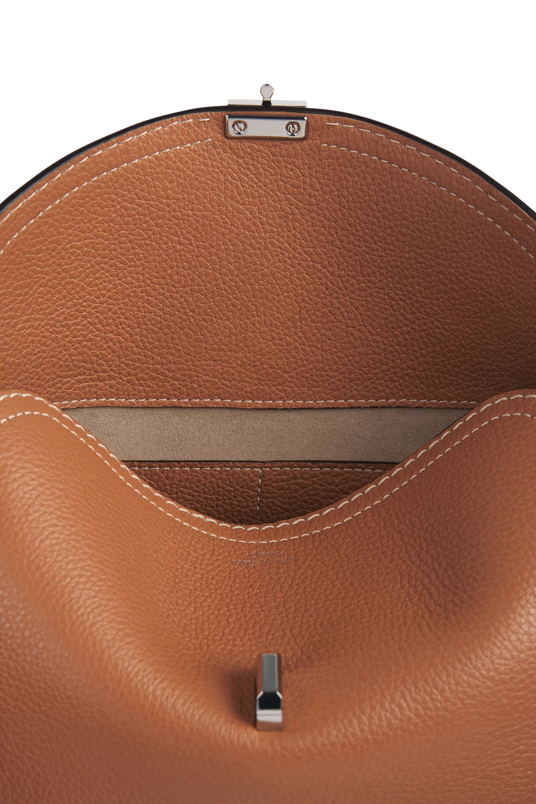 كلاتش بإغلاق على شكل حرف T