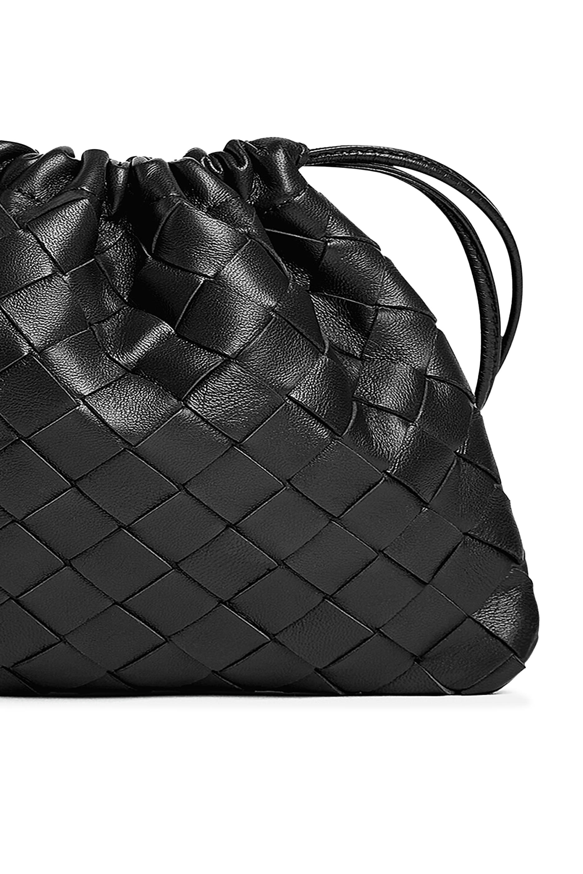 حقيبة بالتصميم المجدول وأربطة تضييق جلد