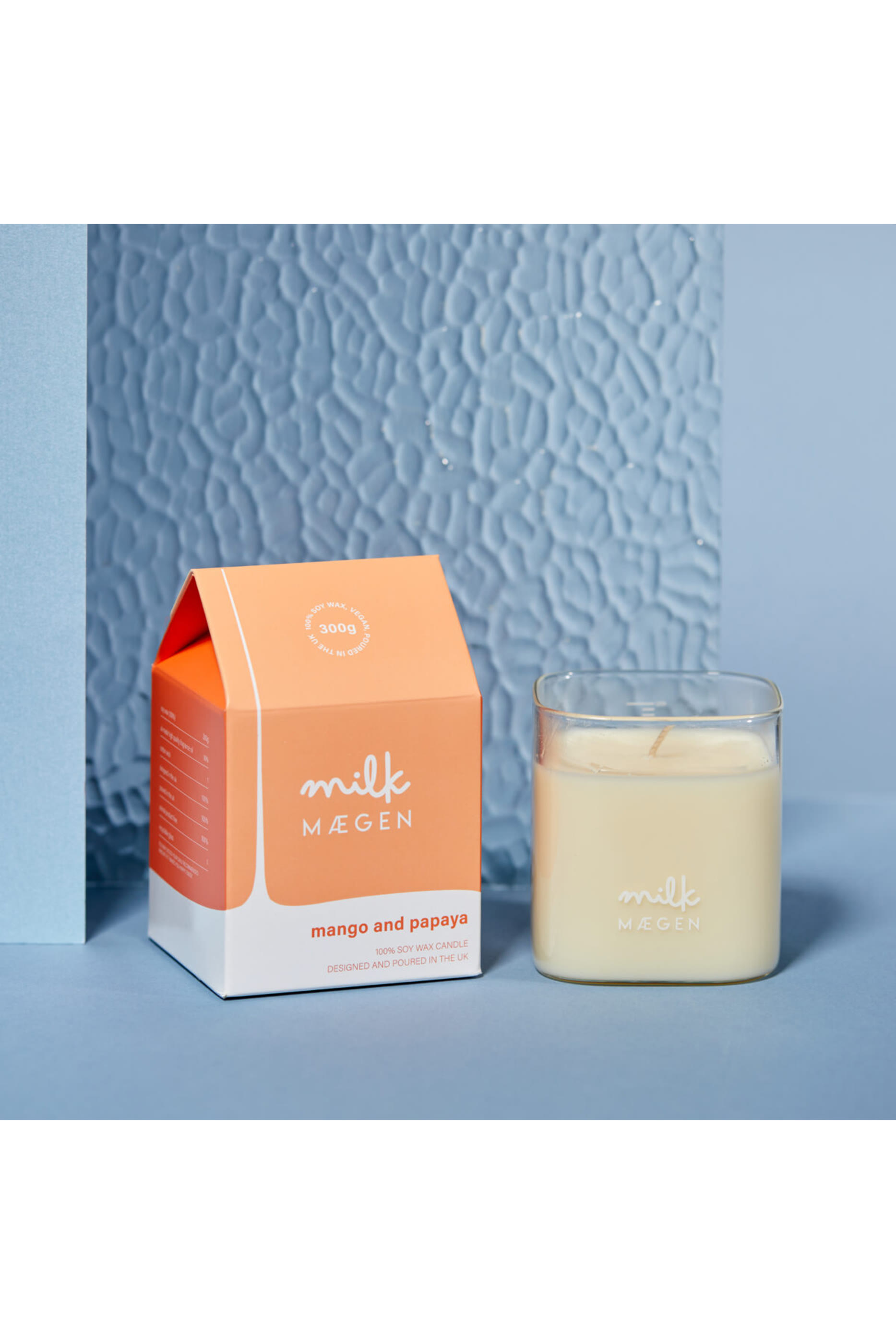 شمعة معطرة برائحة المانجو والبابايا الاستوائية